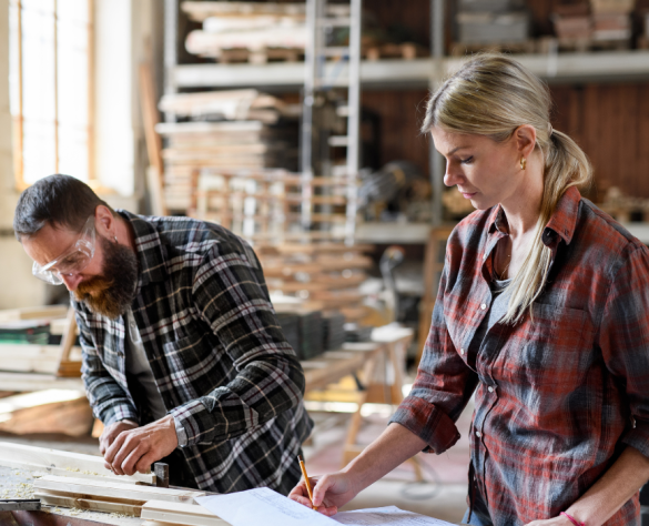 Two People Working in a Woodshop