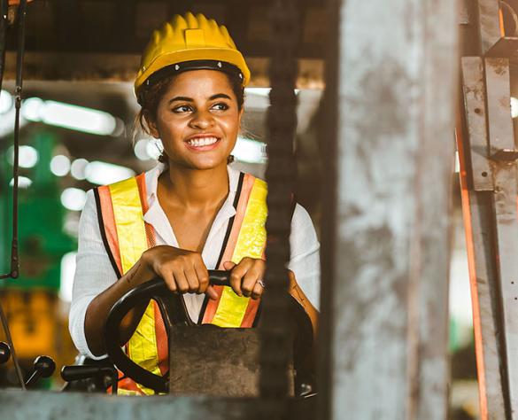 Woman driving a forklift